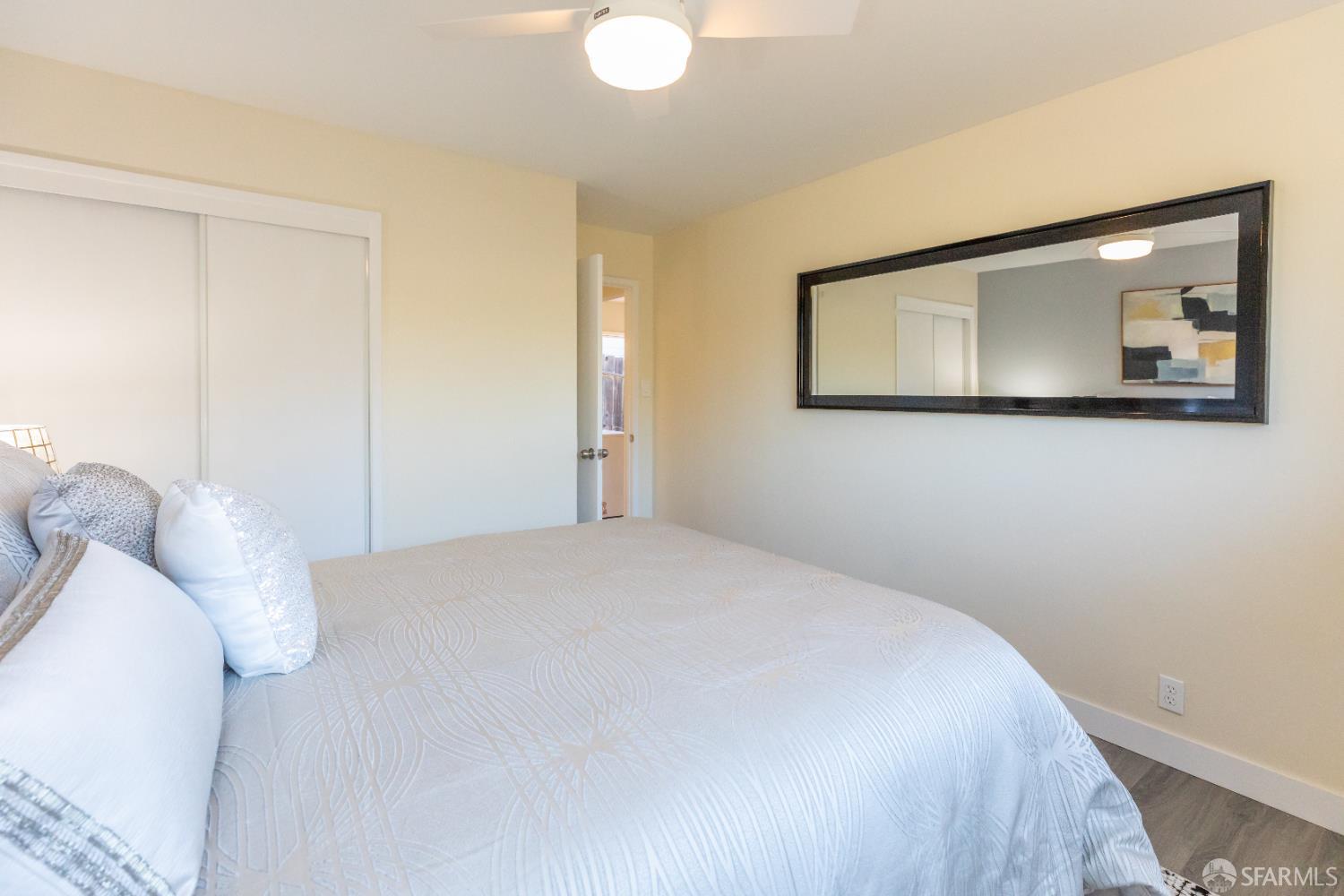 808 Fourth Street Rodeo, CA 94572 - Photo 39 of 70 a bedroom with a bed and painting on the wall