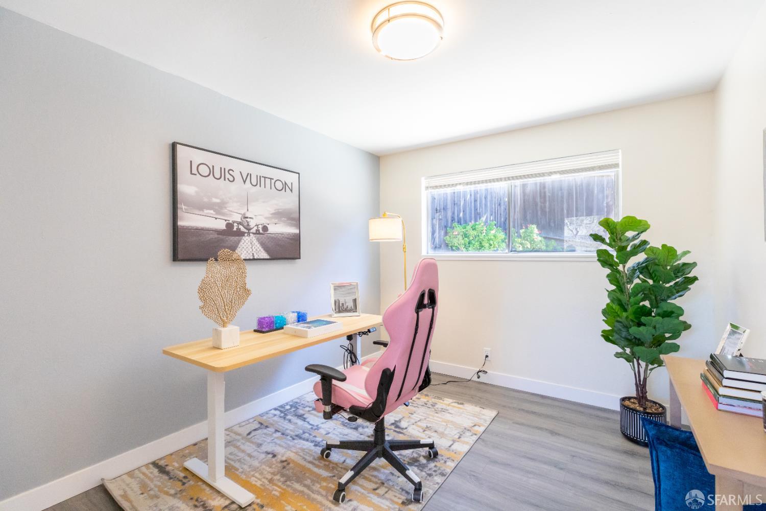 808 Fourth Street Rodeo, CA 94572 - Photo 42 of 70 a workspace with furniture and a potted plant