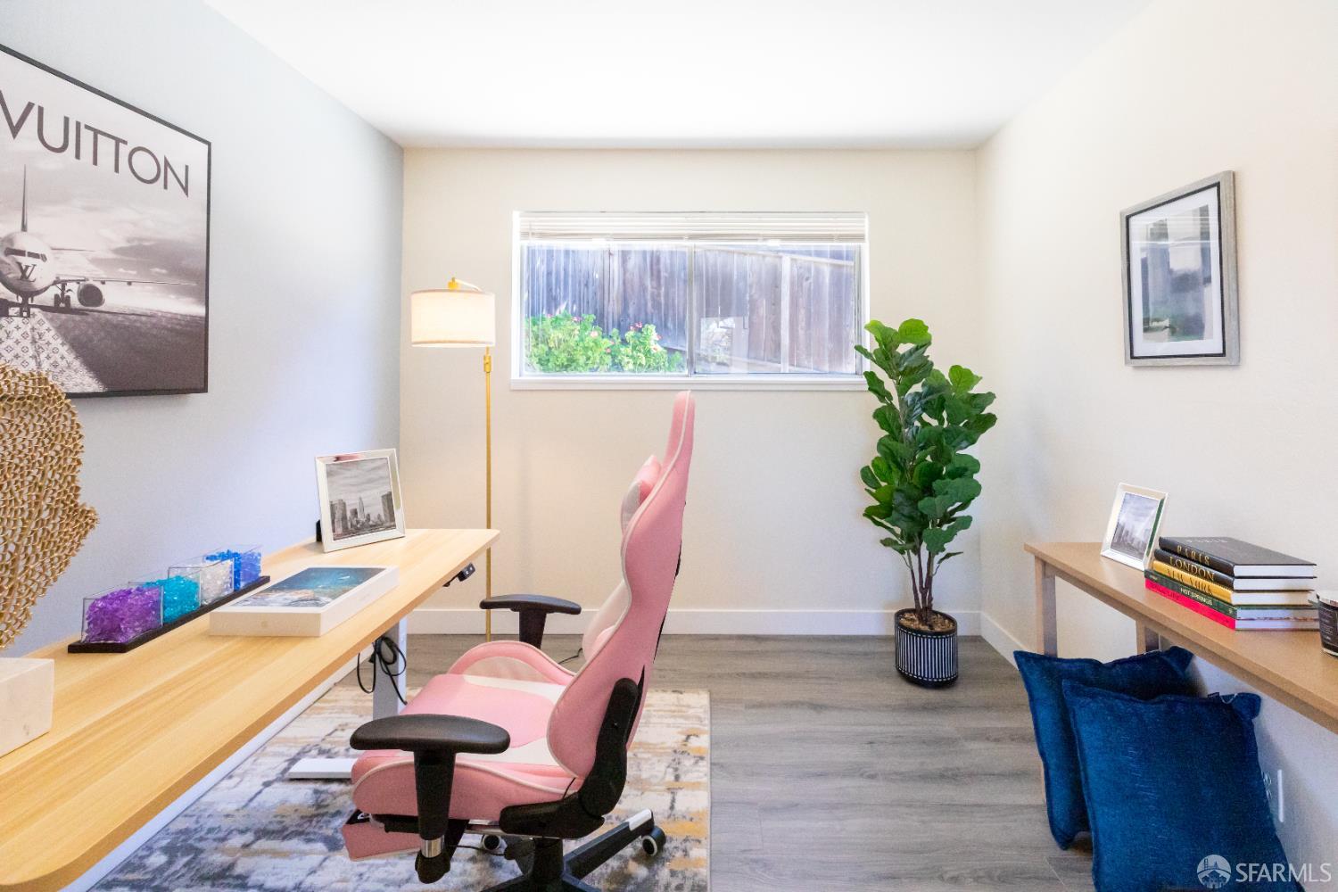 808 Fourth Street Rodeo, CA 94572 - Photo 46 of 70 a view of a workspace with furniture and a potted plant