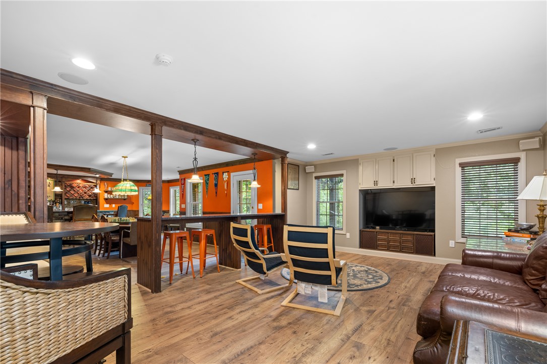 106 Red Maple Way Clemson, SC 29631 - Photo 30 of 49 Rich wood floors and built-in elements frame this versatile, open-concept lower level space.