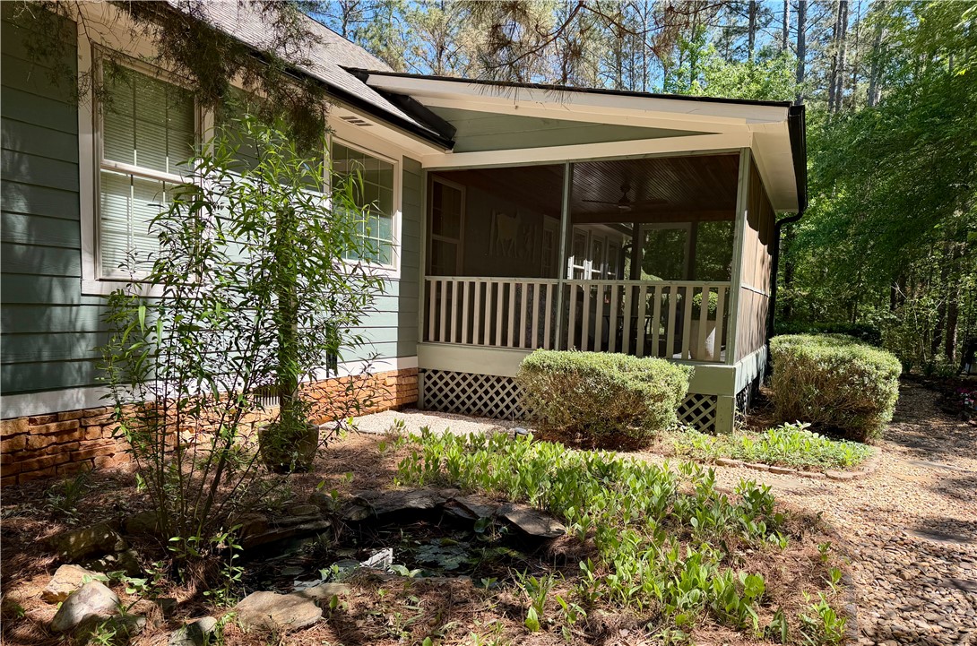 232 Hunters Trail Walhalla, SC 29691 - Photo 34 of 38 This residence features a charming screened porch and well-maintained landscaping, perfect for peaceful enjoyment.