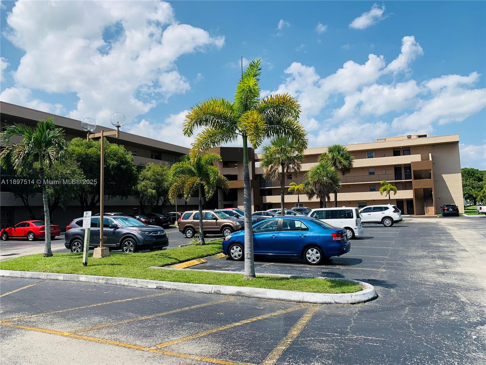 502 Northwest 87th Avenue, Unit 302 Miami, FL 33172 - Photo 11 of 12 a view of outdoor space with swimming pool and furniture