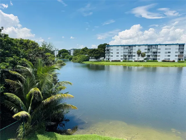 a view of a swimming pool and outdoor seating