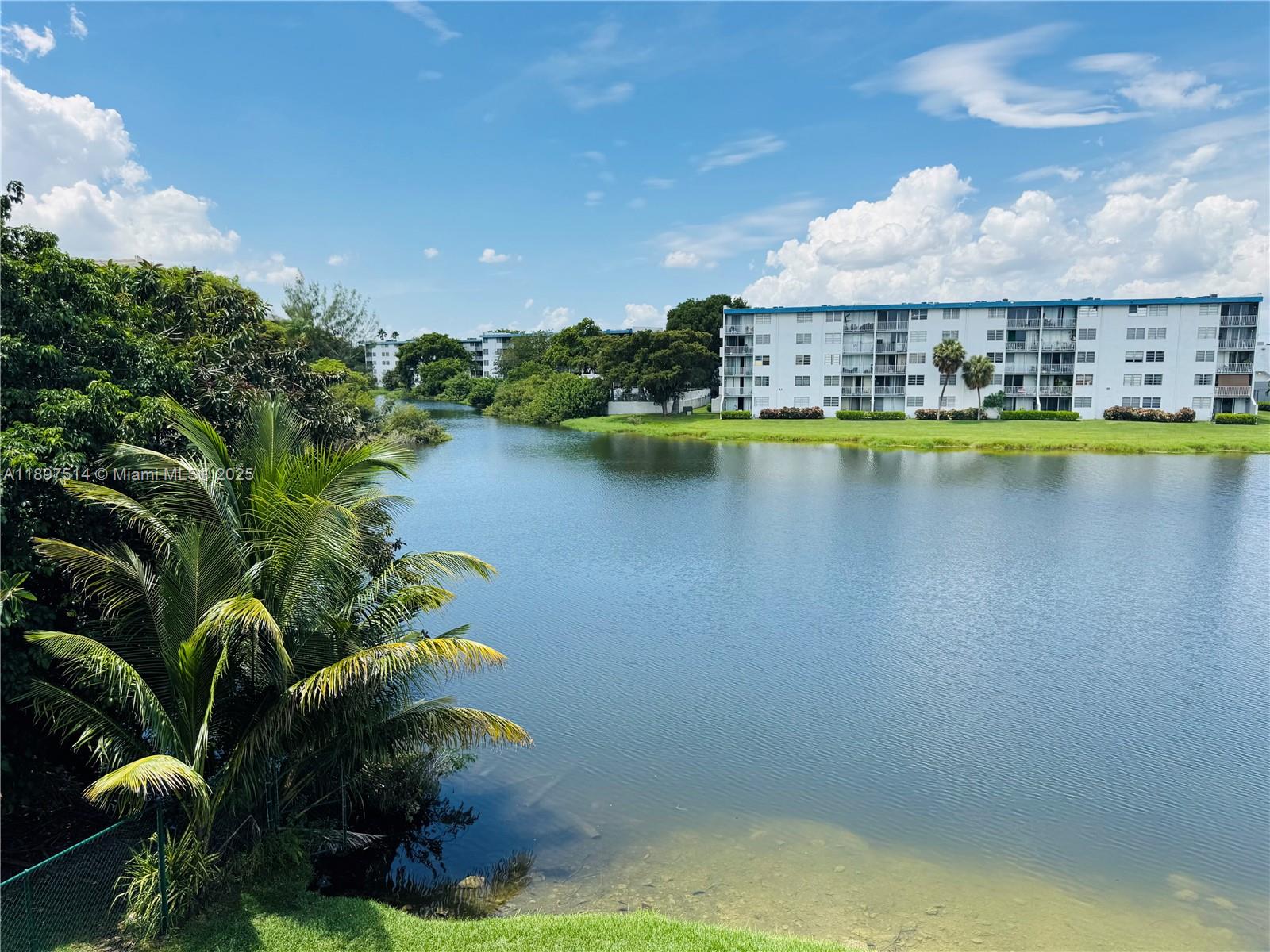 502 Northwest 87th Avenue, Unit 302 Miami, FL 33172 - Photo 3 of 12 a view of a swimming pool and outdoor seating