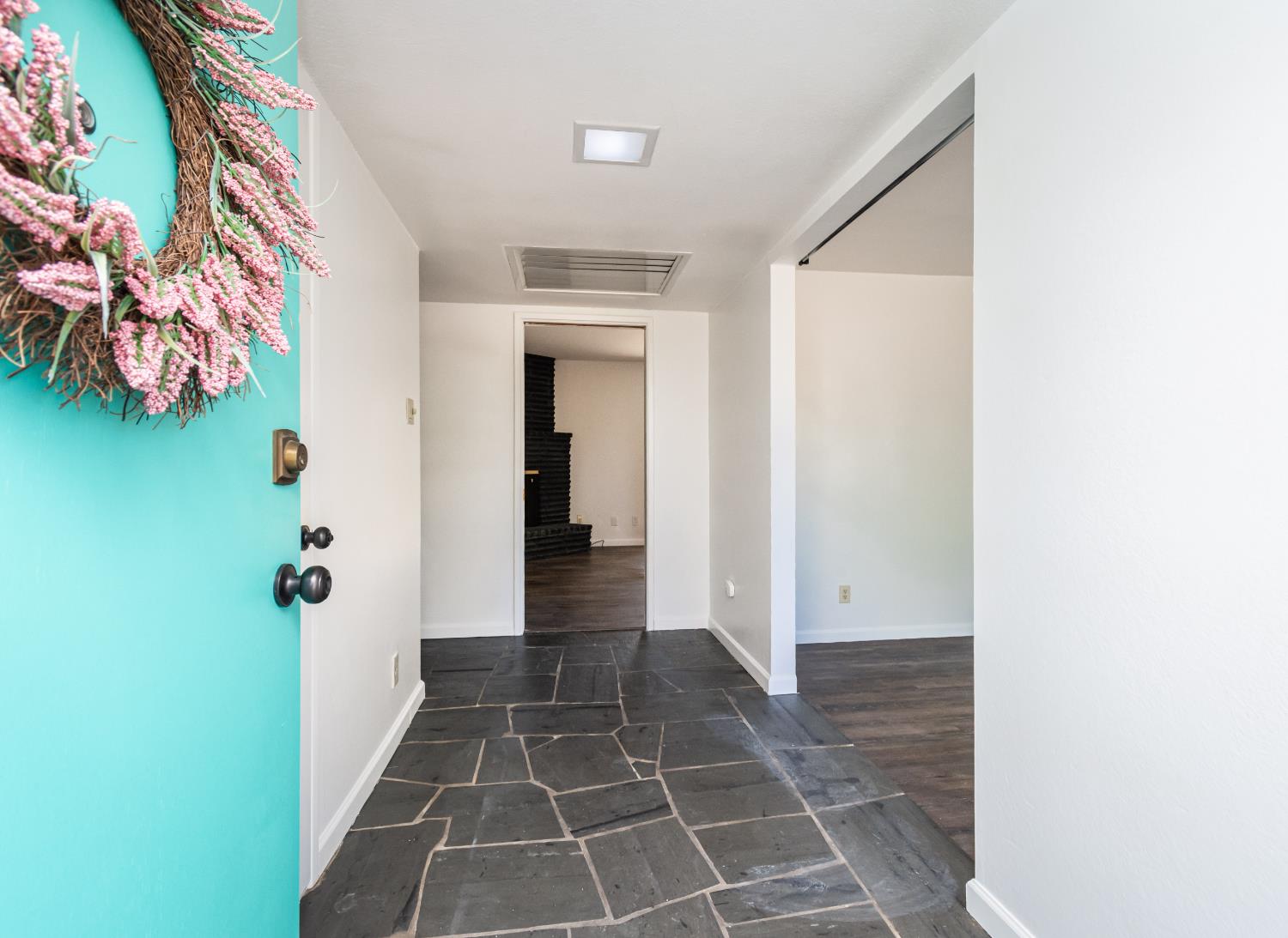 4186 Dena Way Sacramento, CA 95821 - Photo 11 of 48 a view of a hallway with wooden floor and a potted plant