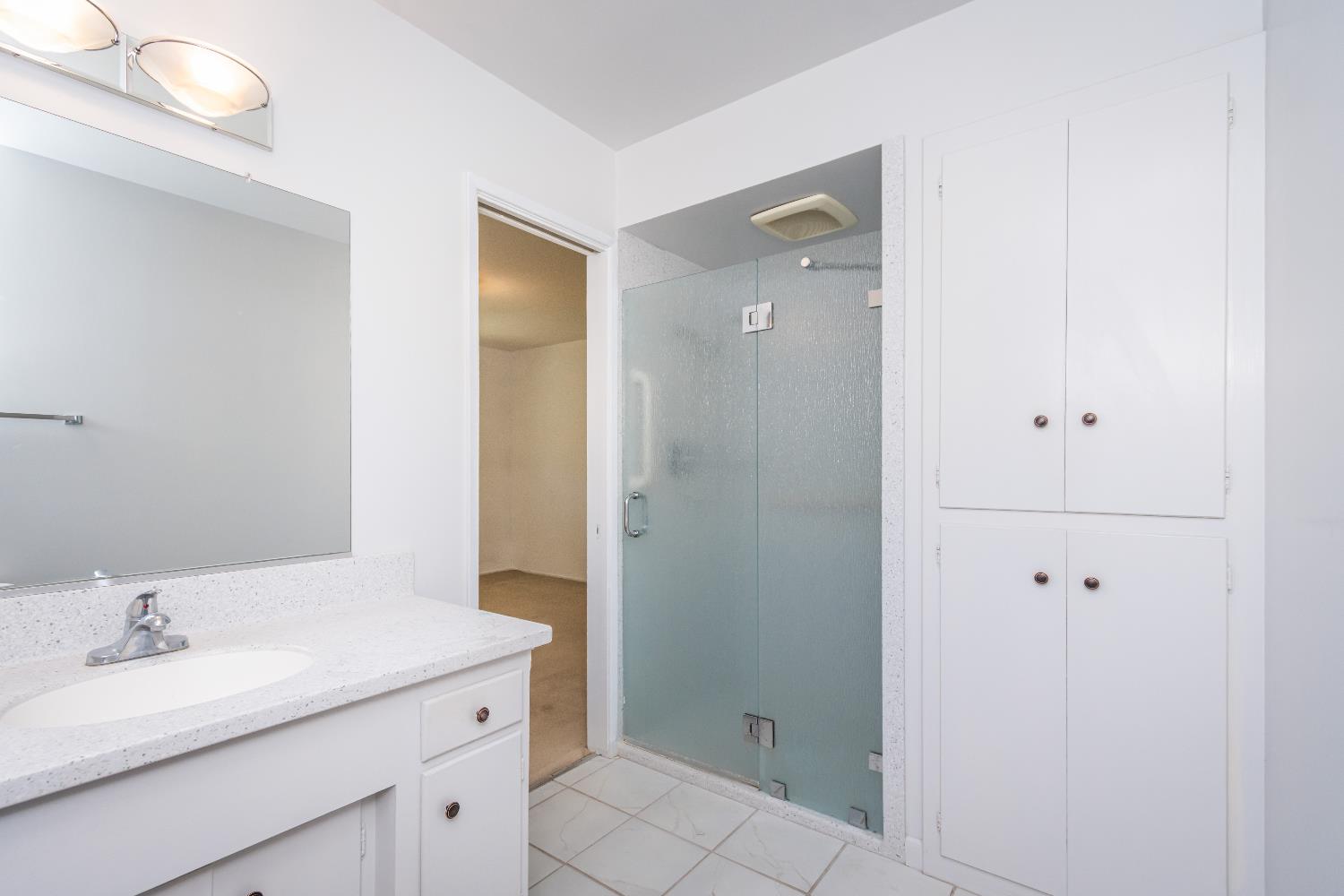 4186 Dena Way Sacramento, CA 95821 - Photo 12 of 48 a bathroom with a granite countertop sink and a mirror