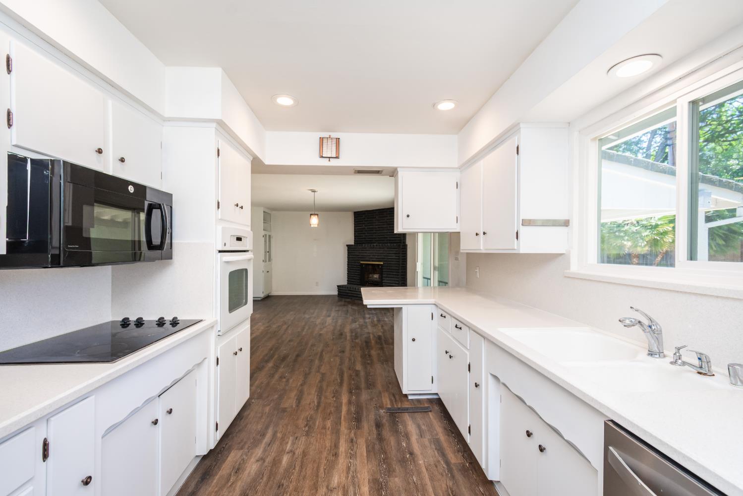 4186 Dena Way Sacramento, CA 95821 - Photo 14 of 48 a large kitchen with a large window and stainless steel appliances