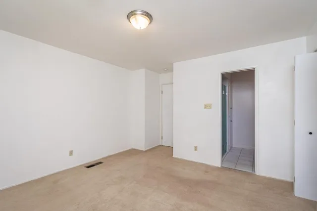 an empty room with closet area