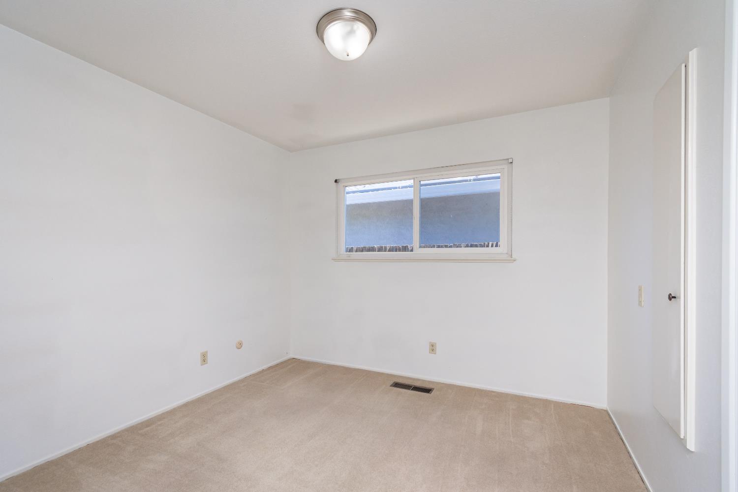 4186 Dena Way Sacramento, CA 95821 - Photo 29 of 48 an empty room with a window
