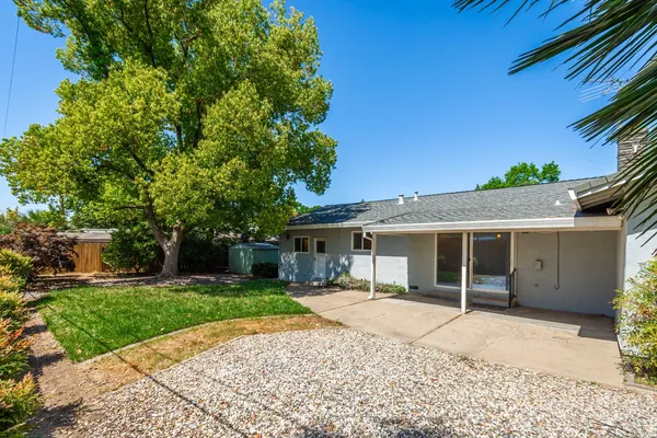 a house with trees in the background