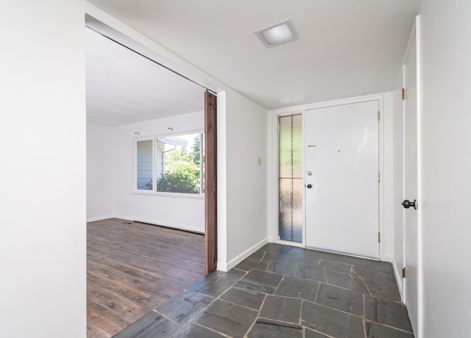 4186 Dena Way Sacramento, CA 95821 - Photo 10 of 48 a view of an empty room with wooden floor and a window