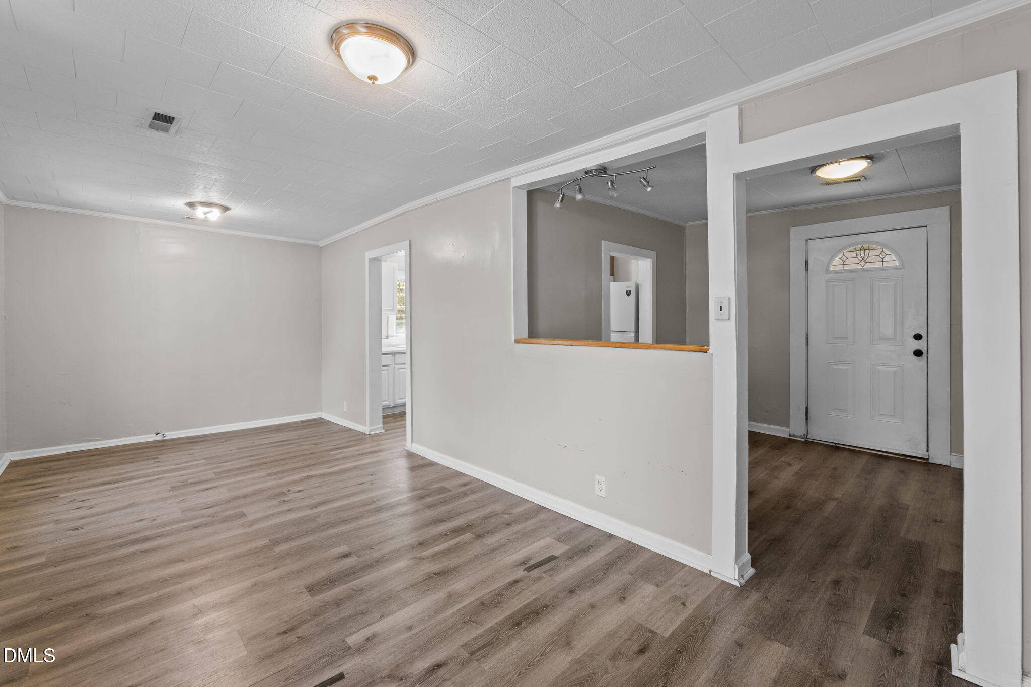 560 Harper Road Hillsborough, NC 27278 - Photo 11 of 44 a view of an empty room with wooden floor and a window