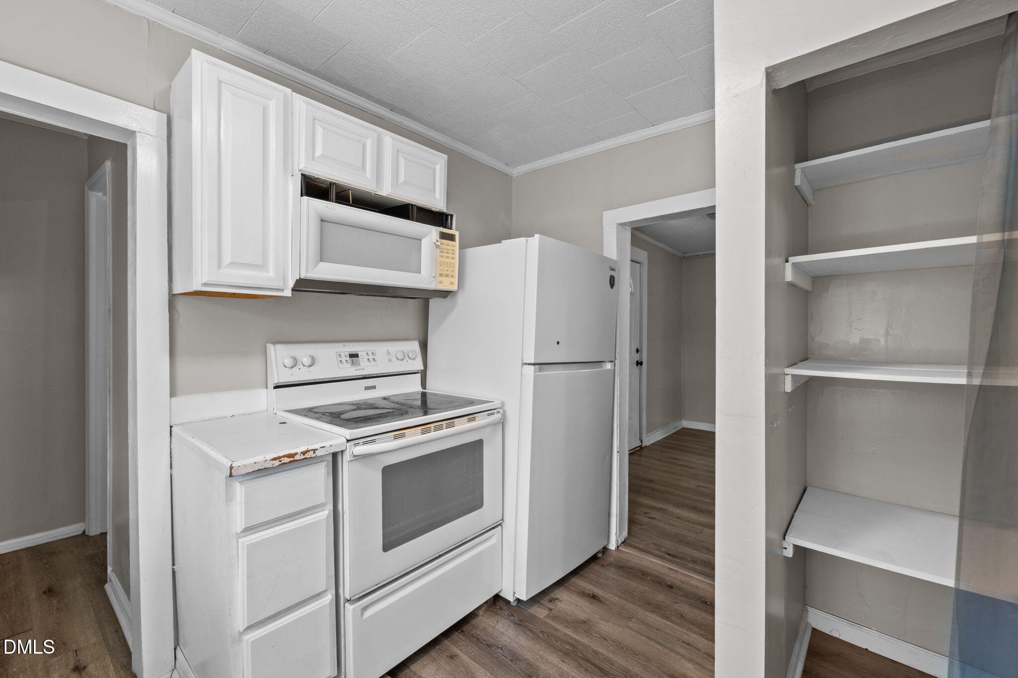 560 Harper Road Hillsborough, NC 27278 - Photo 16 of 44 a kitchen with a stove refrigerator and cabinets