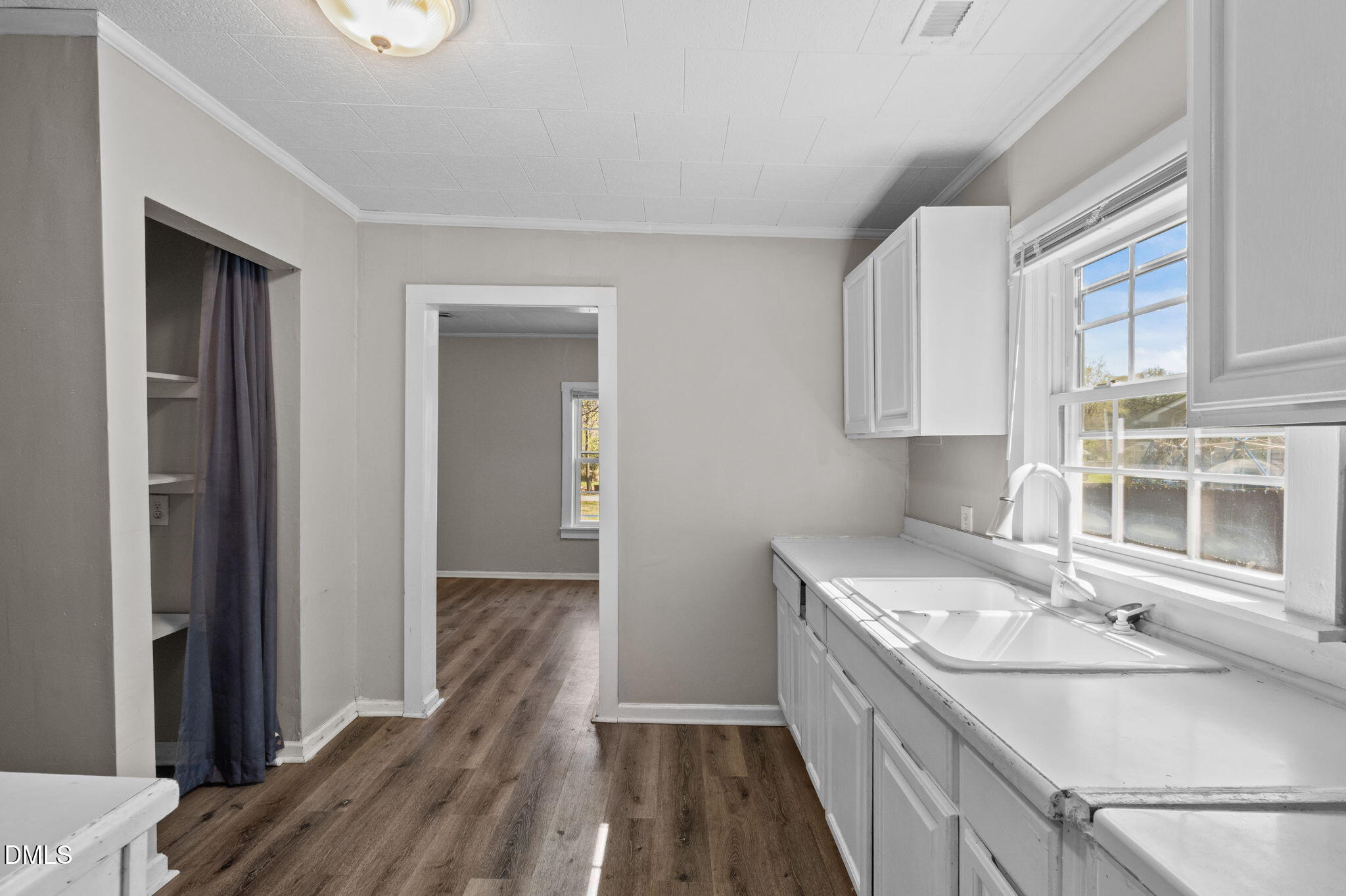 560 Harper Road Hillsborough, NC 27278 - Photo 17 of 44 a kitchen with a sink stove and cabinets