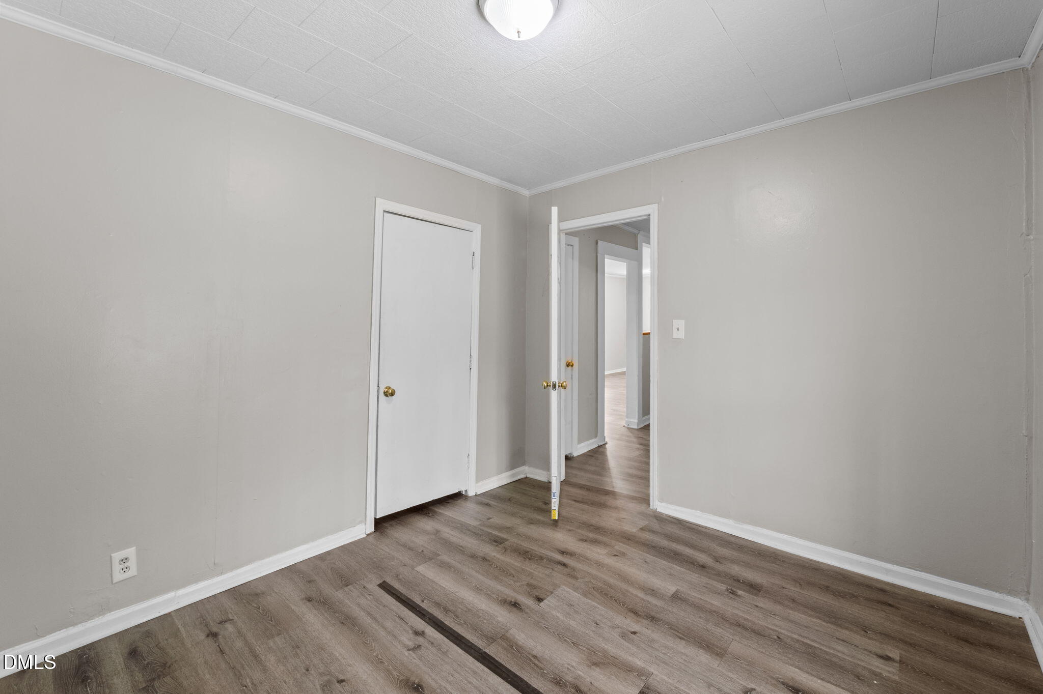 560 Harper Road Hillsborough, NC 27278 - Photo 23 of 44 a view of an empty room with wooden floor