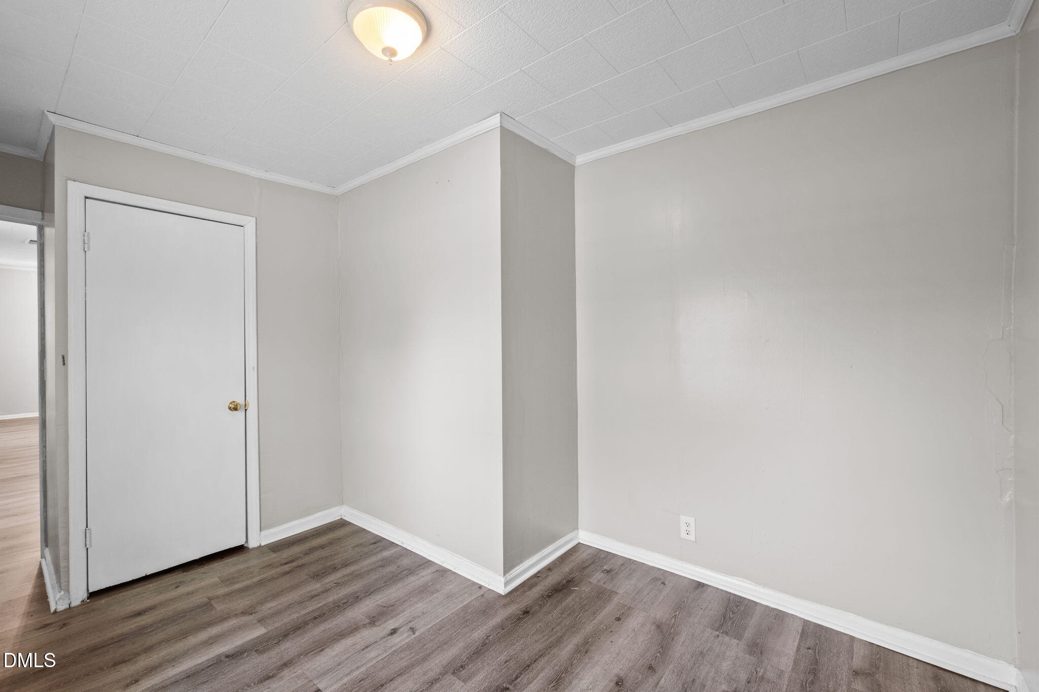 560 Harper Road Hillsborough, NC 27278 - Photo 26 of 44 a view of an empty room with wooden floor and windows