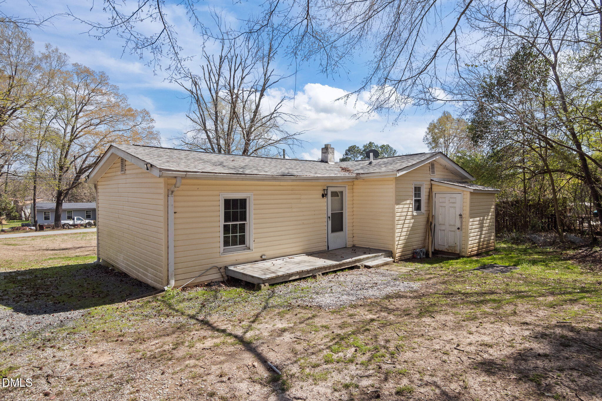 560 Harper Road Hillsborough, NC 27278 - Photo 30 of 44 a view of a house with a yard covered with snow