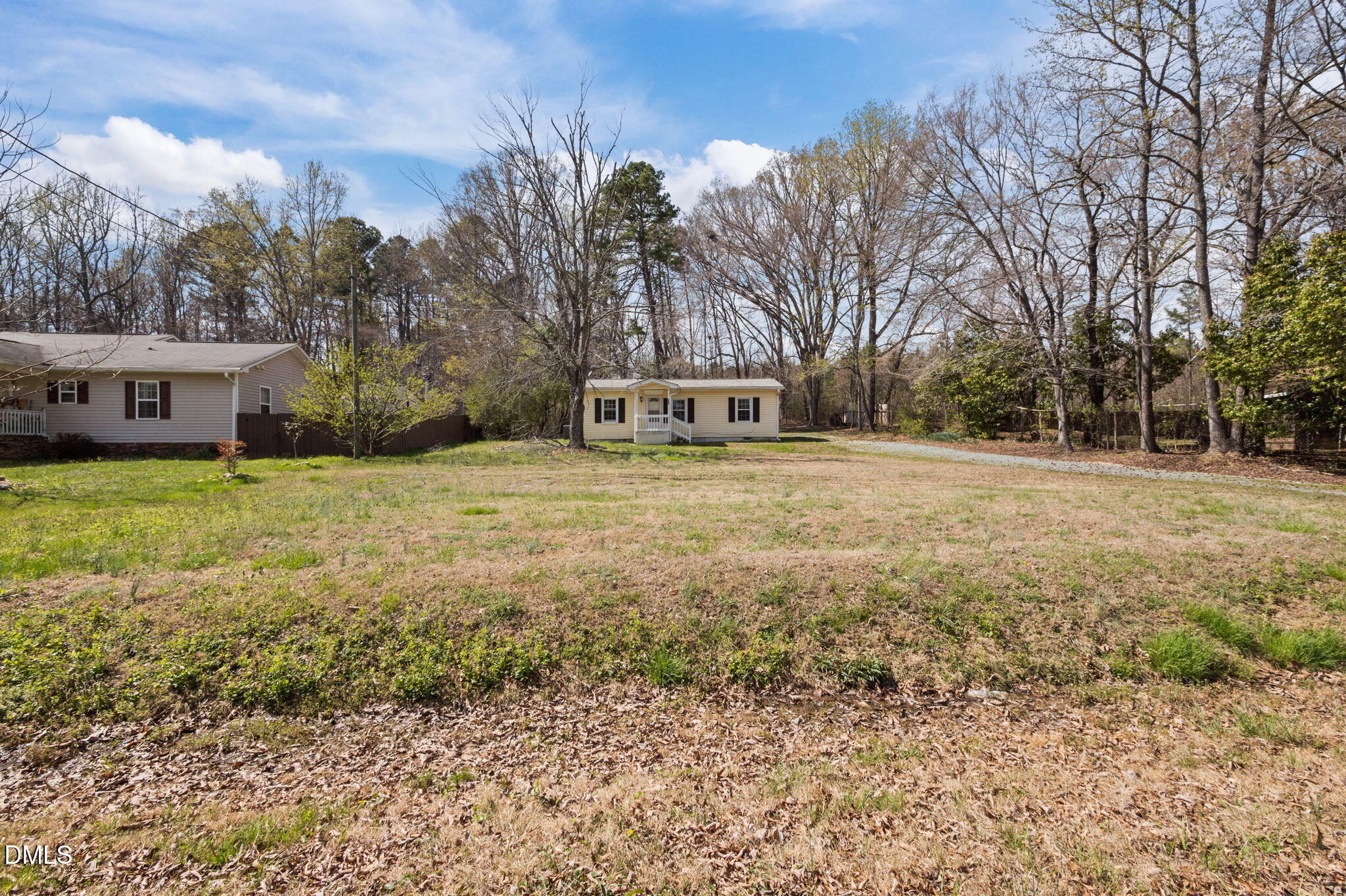 560 Harper Road Hillsborough, NC 27278 - Photo 4 of 44 a view of a house with a yard