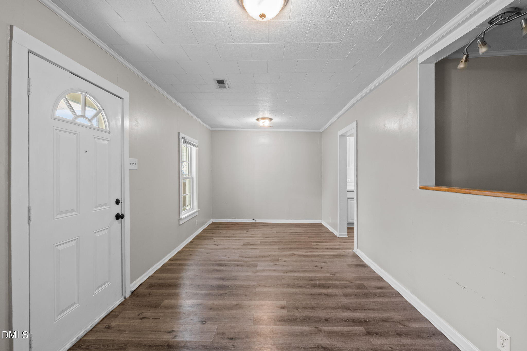 560 Harper Road Hillsborough, NC 27278 - Photo 9 of 44 a view of a hallway with wooden floor