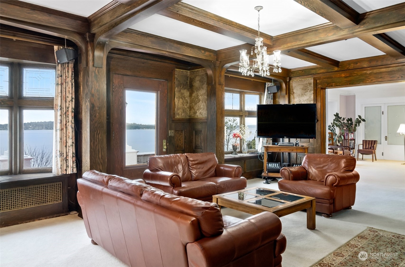 6601 Northeast Windermere Road Seattle, WA 98115 - Photo 13 of 29 a living room with furniture a flat screen tv and a chandelier