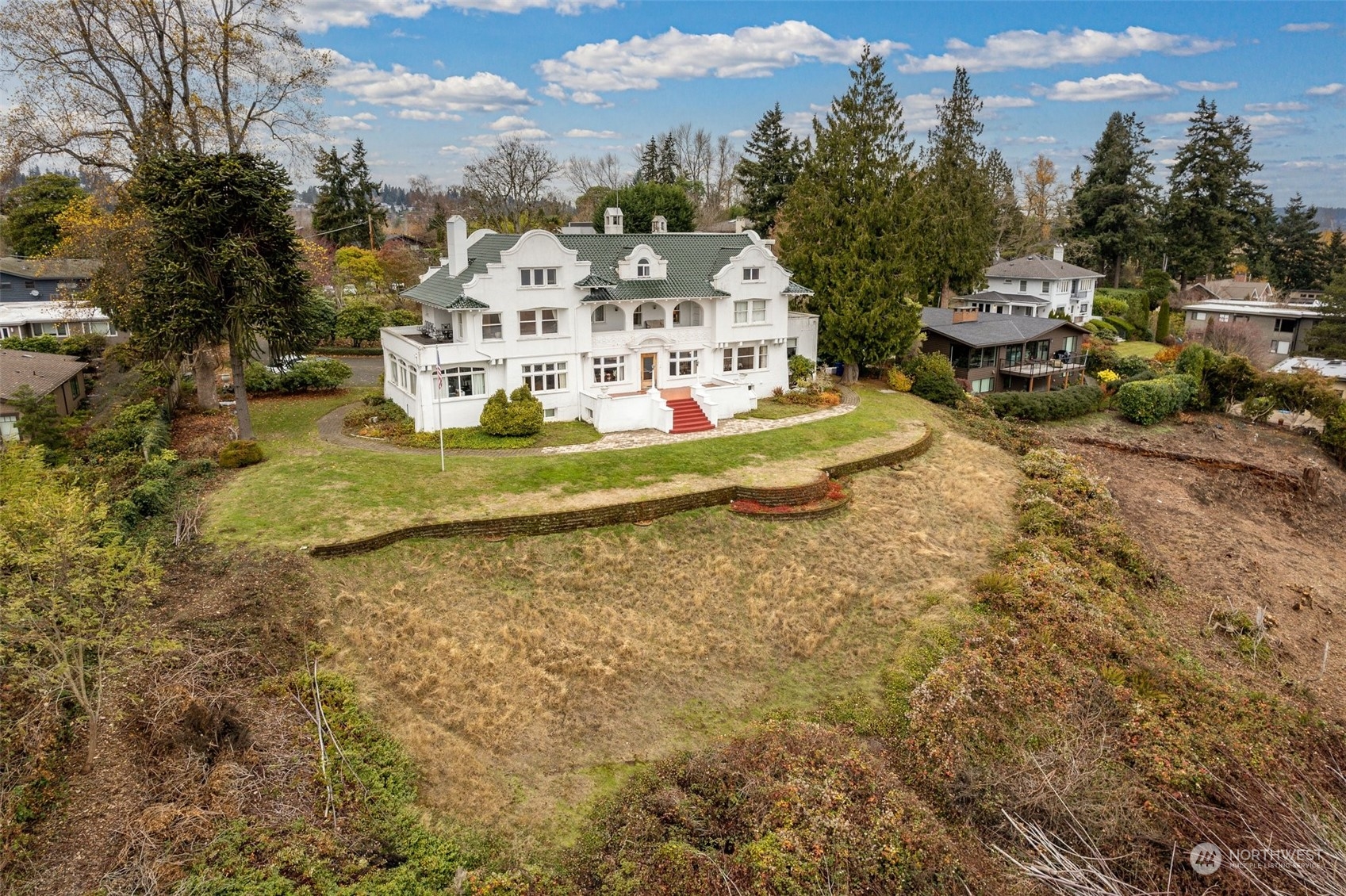 6601 Northeast Windermere Road Seattle, WA 98115 - Photo 3 of 29 a view of a white house with a yard and sitting area