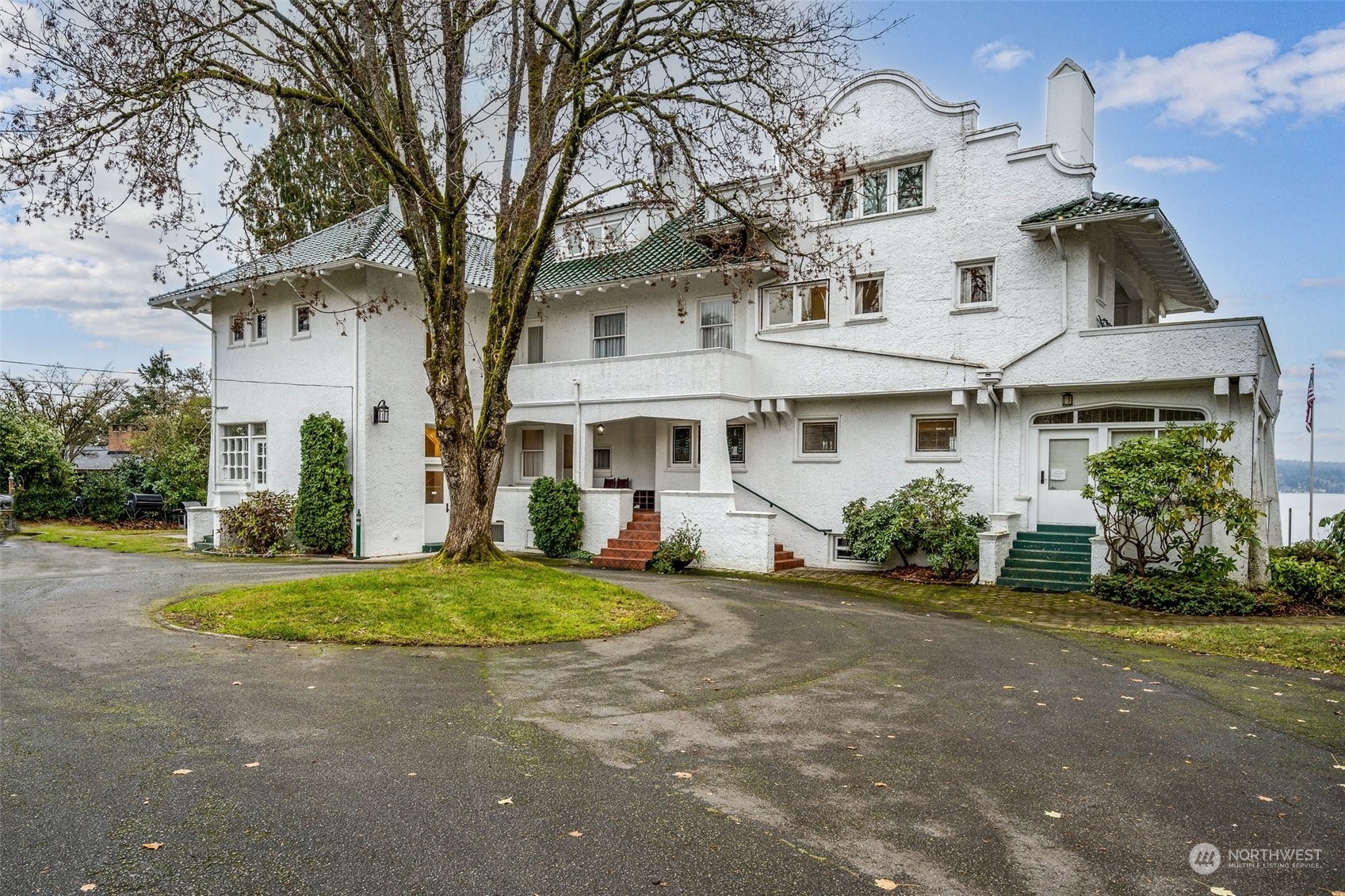 6601 Northeast Windermere Road Seattle, WA 98115 - Photo 10 of 29 a front view of a house with a yard and potted plants