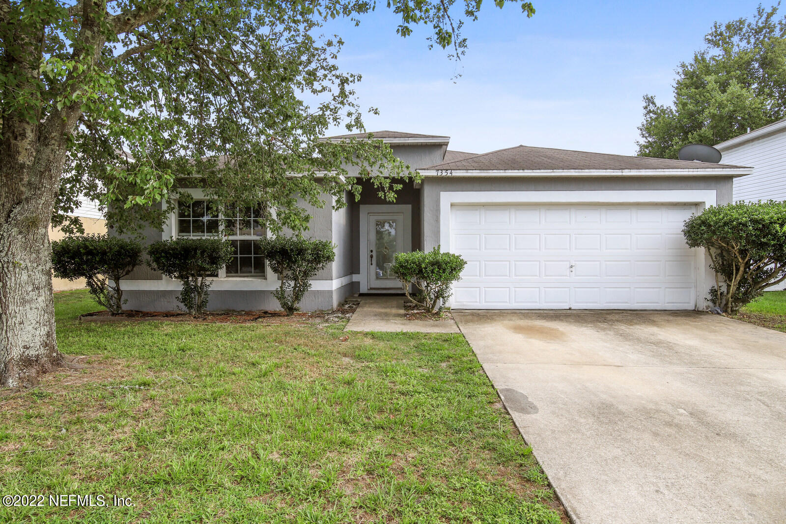 7354 High Bluff Road North Jacksonville, FL 32244 - Photo 1 of 26 a view of a house with backyard and sitting area