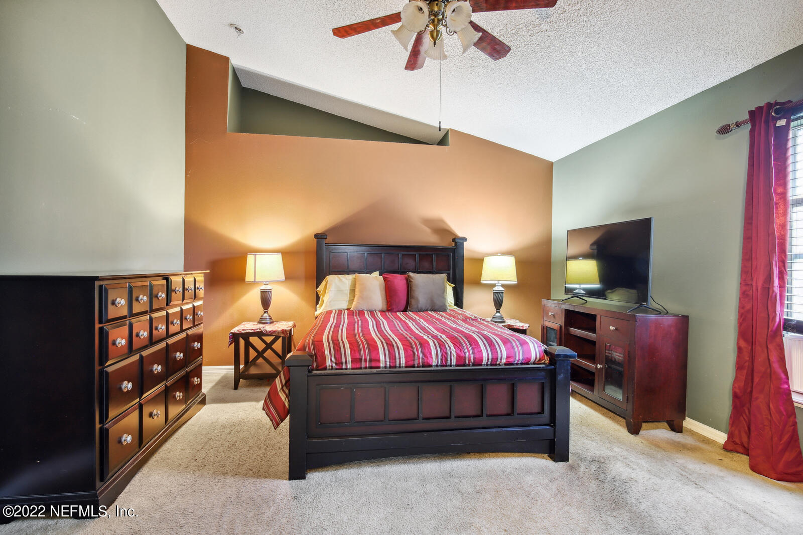 7354 High Bluff Road North Jacksonville, FL 32244 - Photo 13 of 26 a bedroom with a bed and a flat screen tv