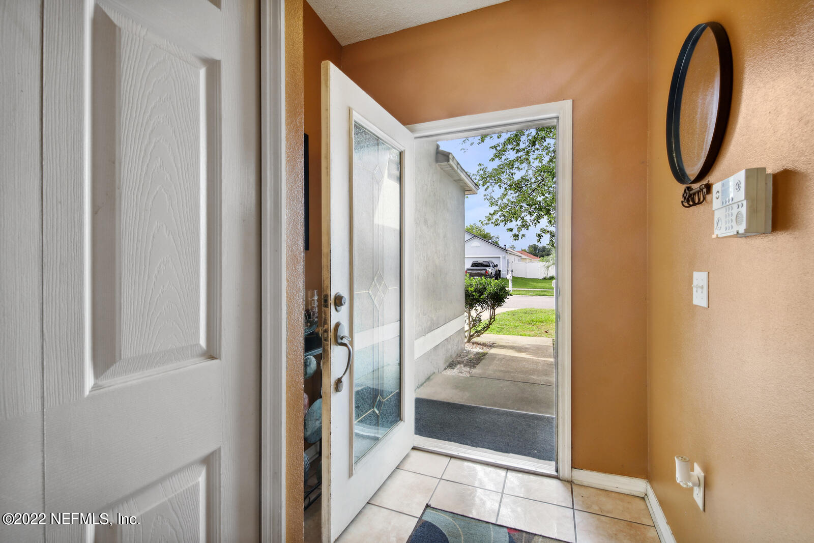 7354 High Bluff Road North Jacksonville, FL 32244 - Photo 4 of 26 a bathroom with a glass shower door and a mirror