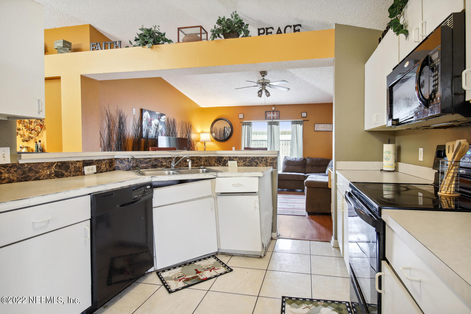 7354 High Bluff Road North Jacksonville, FL 32244 - Photo 10 of 26 a kitchen with a sink stove and cabinets