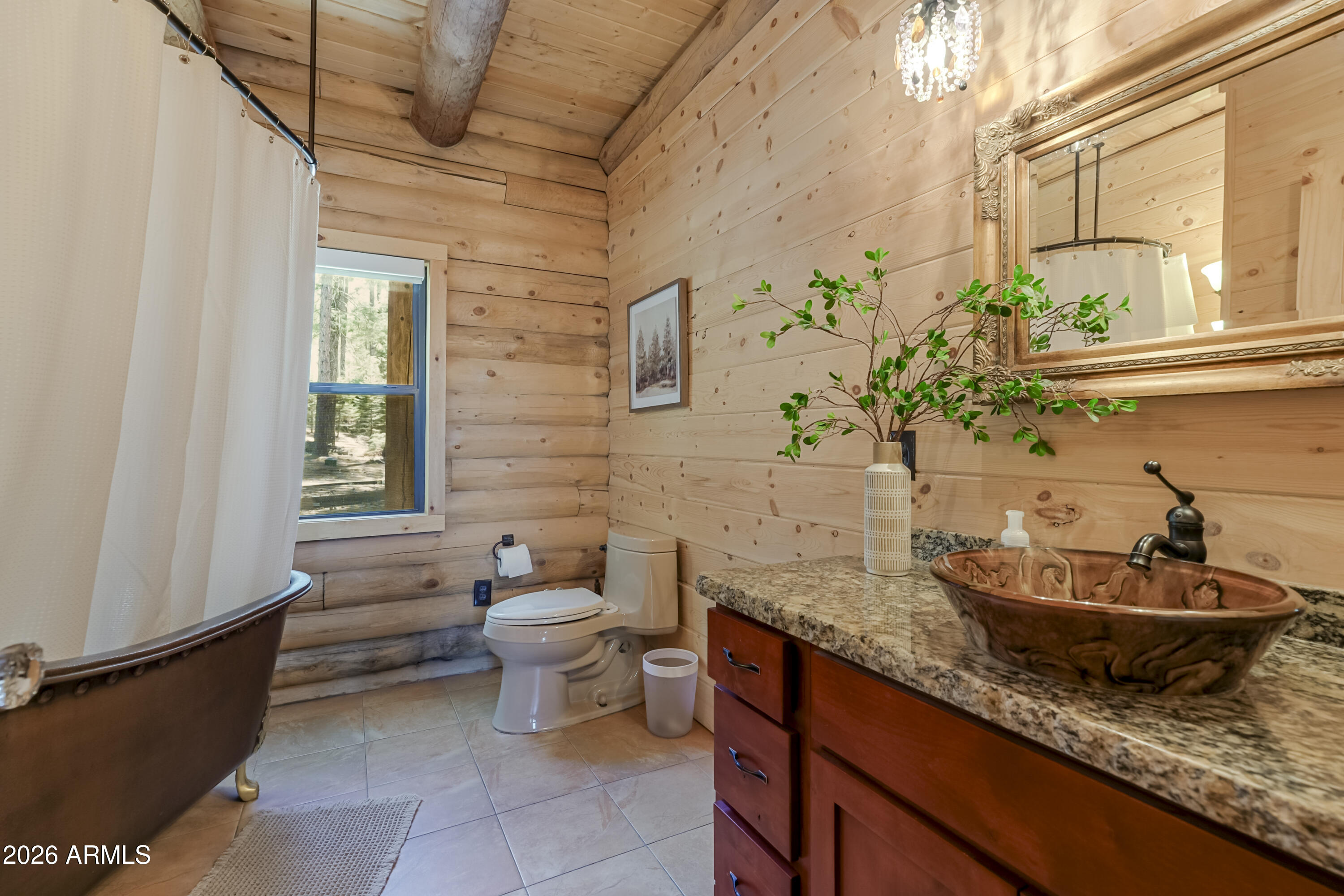 8105 South Comstock Mine Road Prescott, AZ 86303 - Photo 17 of 62 a bathroom with a granite countertop sink and a toilet