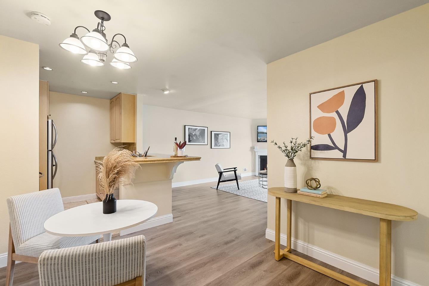 397 Imperial Way, Unit 331 Daly City, CA 94015 - Photo 1 of 17 a living room with furniture a dining table and wooden floor