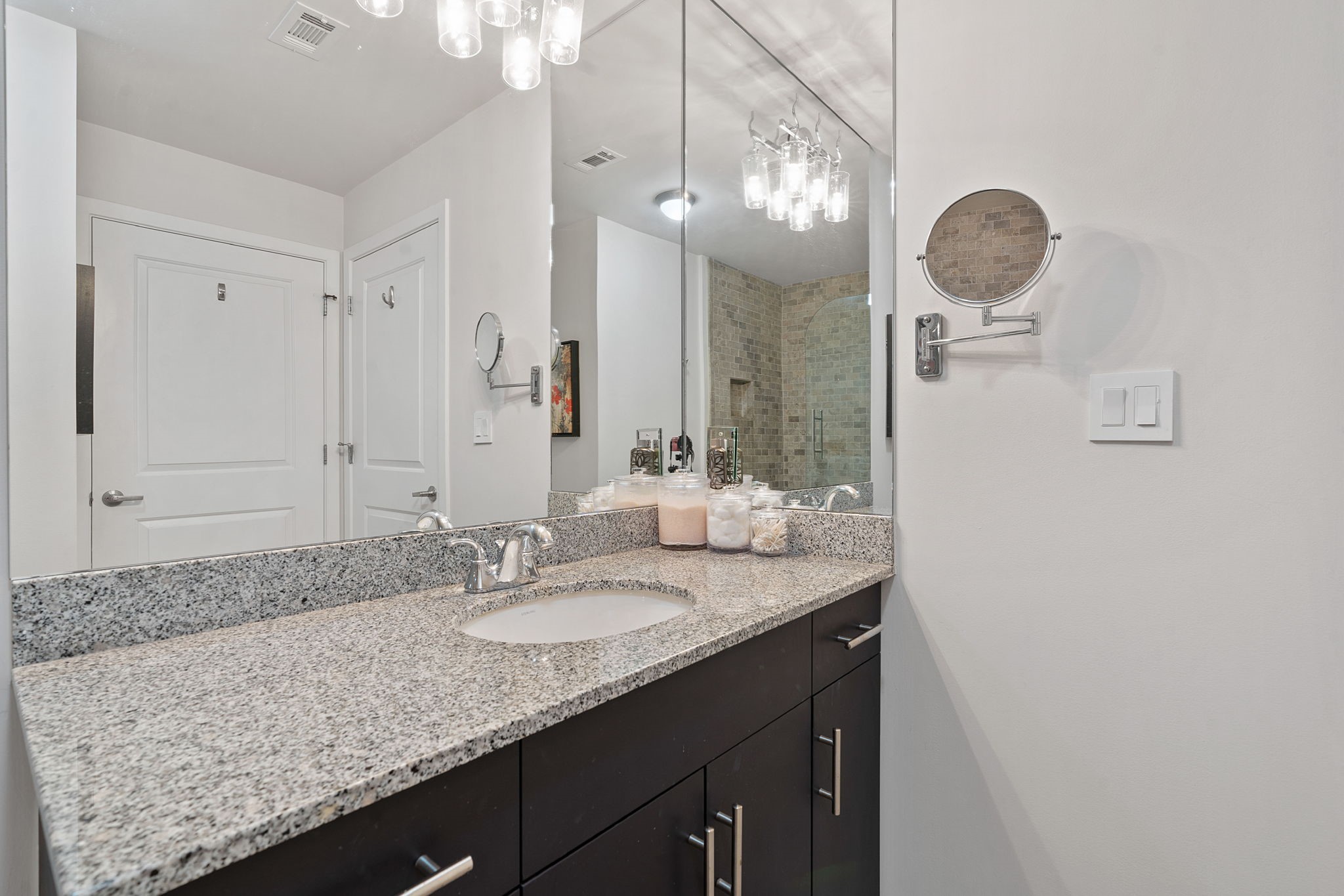 360 Nueces Street, Unit 1310 Austin, TX 78701 - Photo 20 of 40 a bathroom with a granite countertop sink and a mirror