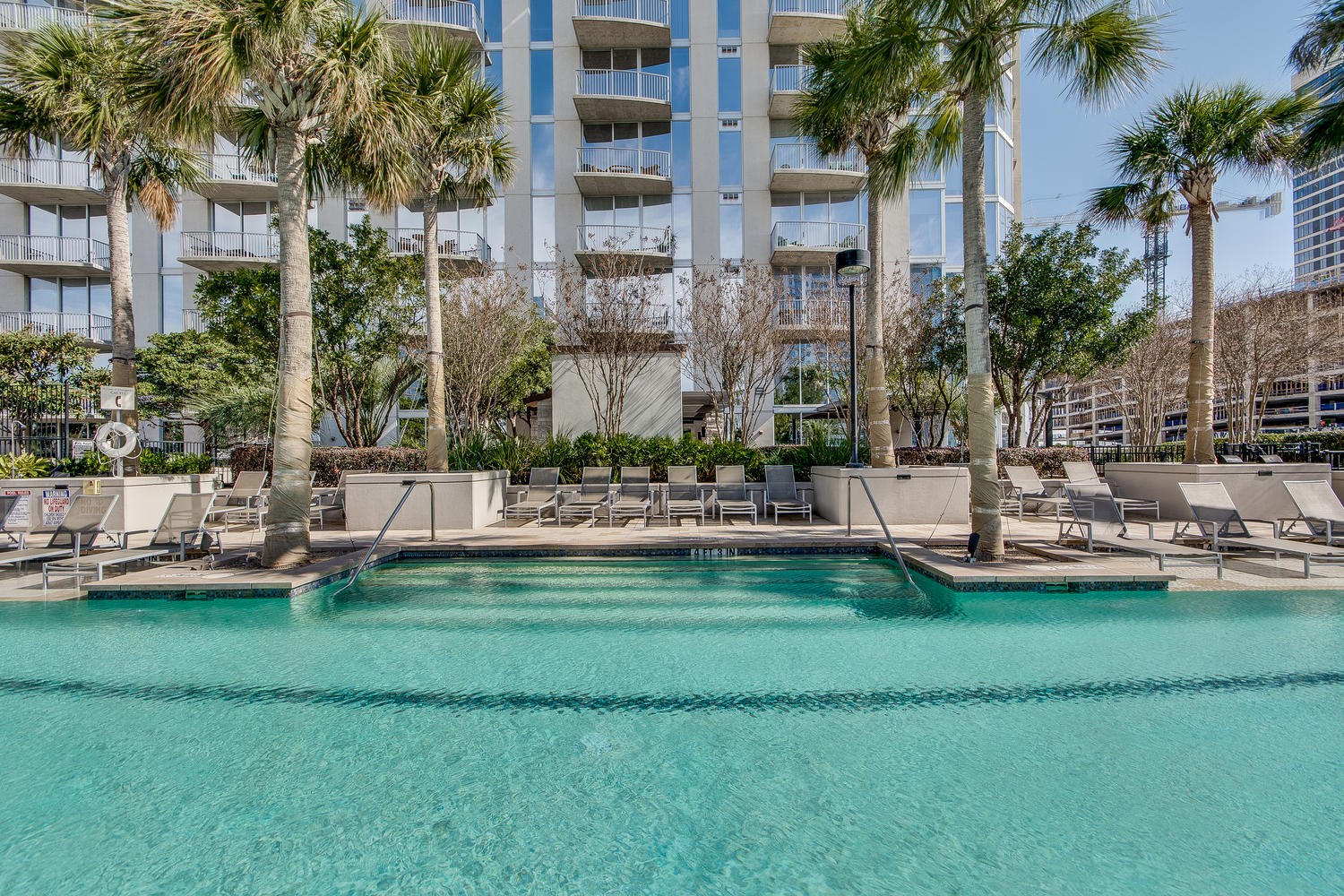360 Nueces Street, Unit 1310 Austin, TX 78701 - Photo 32 of 40 a large building with trees in front of it