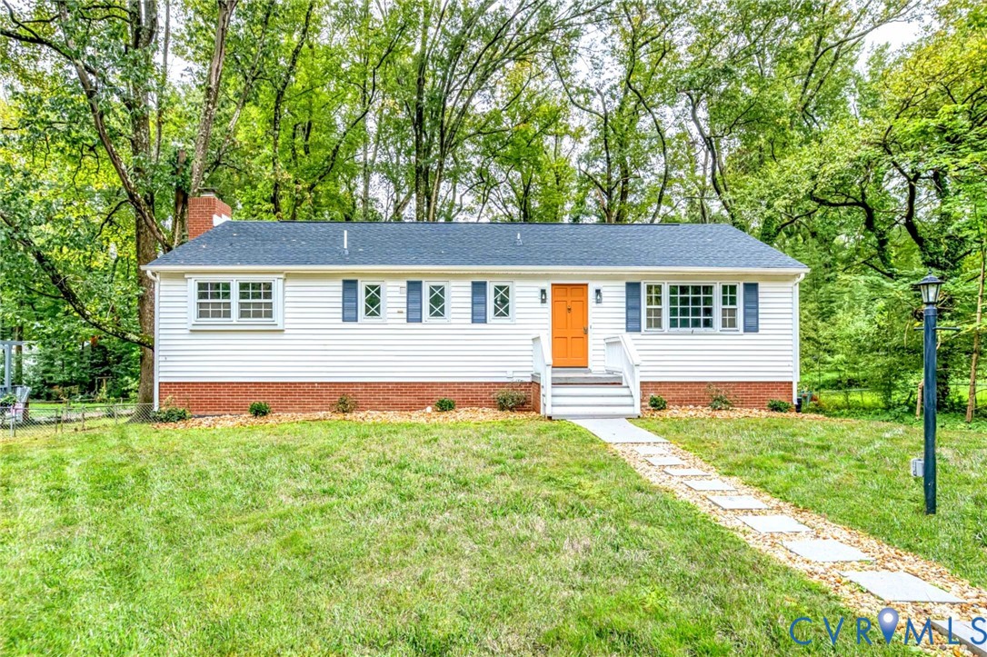 7901 Jahnke Road Richmond, VA 23235 - Photo 1 of 1 View of front facade featuring a front yard, a chi