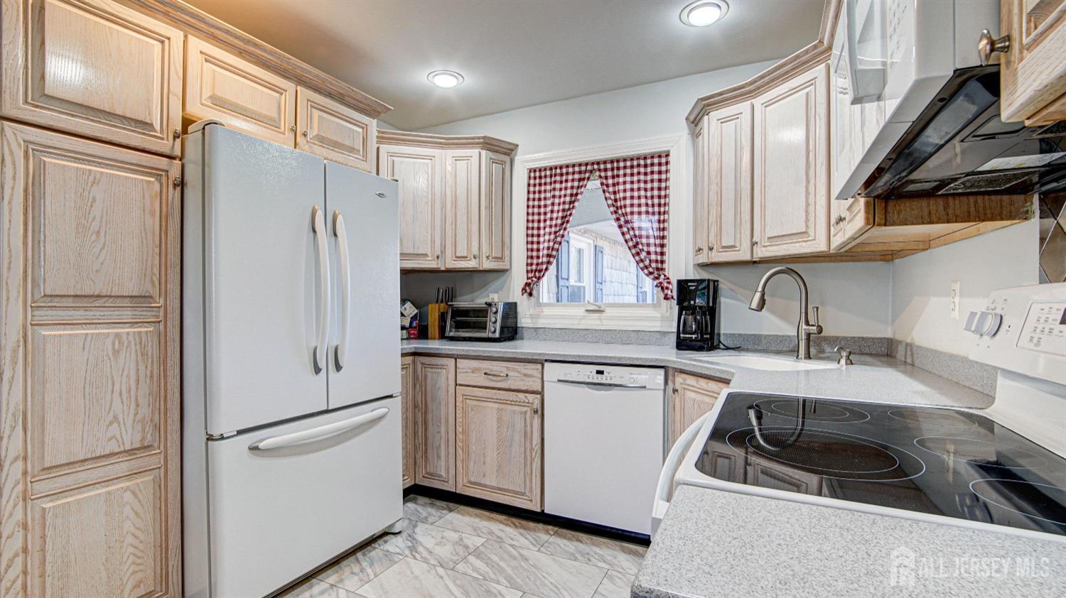 38 Mistletoe Drive Old Bridge, NJ 07747 - Photo 19 of 41 a kitchen with stainless steel appliances a refrigerator sink and cabinets
