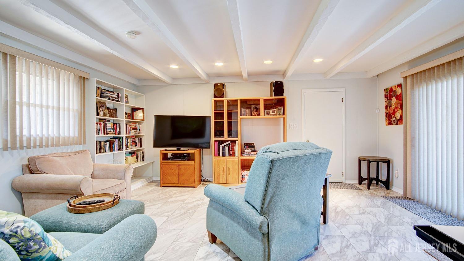 38 Mistletoe Drive Old Bridge, NJ 07747 - Photo 20 of 41 a living room with furniture and a flat screen tv