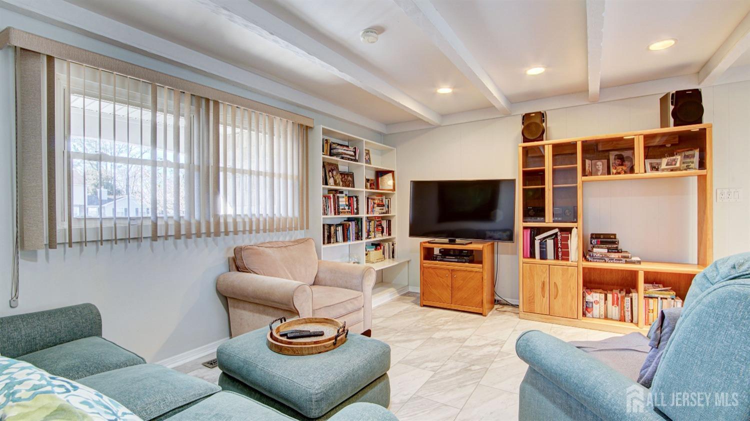 38 Mistletoe Drive Old Bridge, NJ 07747 - Photo 21 of 41 a living room with furniture and a flat screen tv