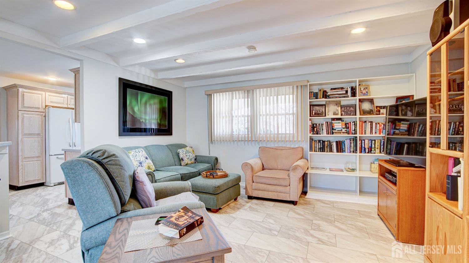 38 Mistletoe Drive Old Bridge, NJ 07747 - Photo 22 of 41 a living room with furniture and a flat screen tv