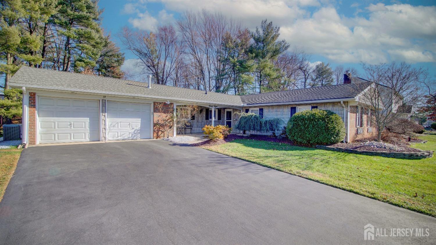 38 Mistletoe Drive Old Bridge, NJ 07747 - Photo 3 of 41 a view of a house with a yard and a garage