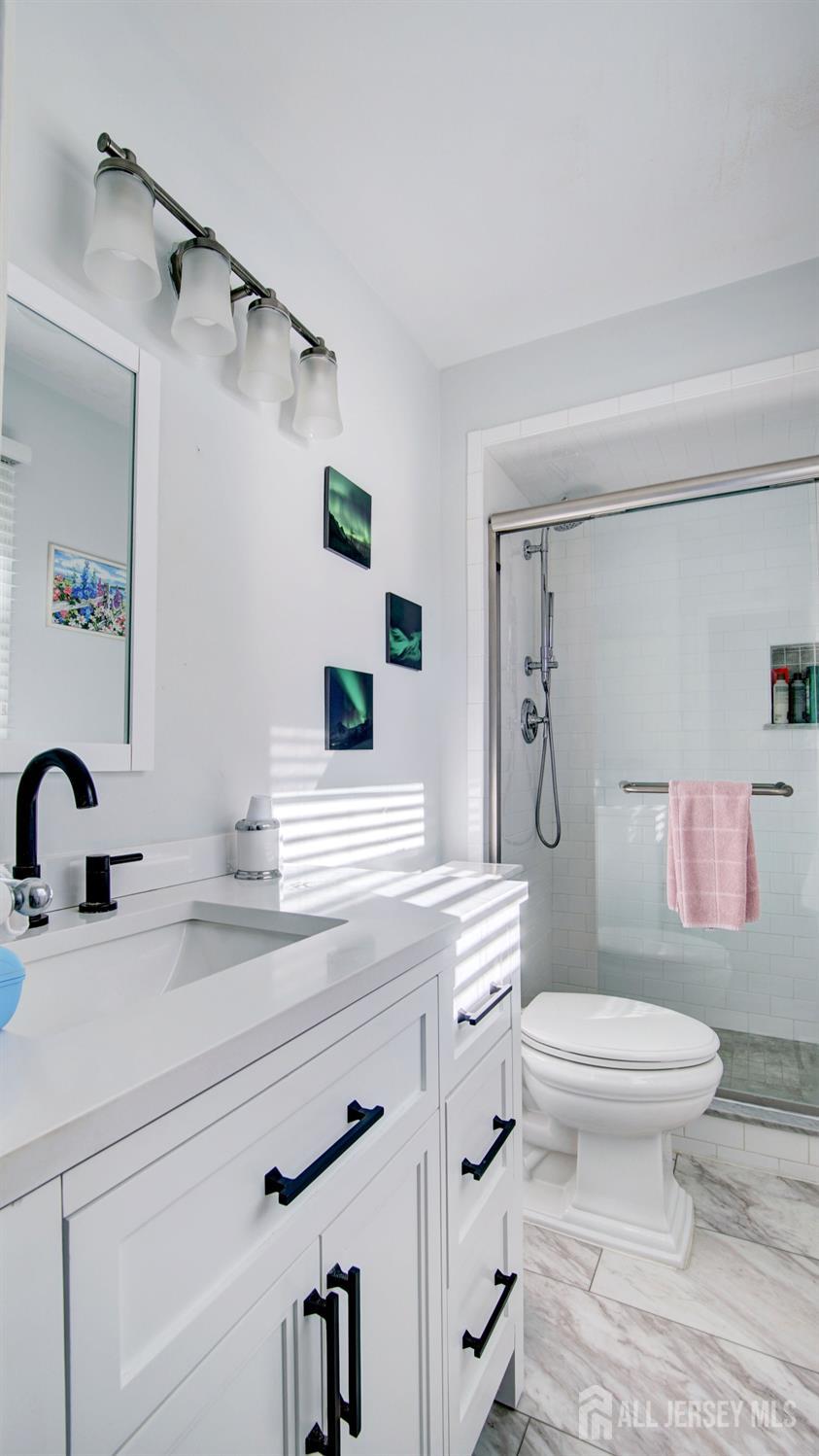 38 Mistletoe Drive Old Bridge, NJ 07747 - Photo 34 of 41 a bathroom with a sink toilet and shower