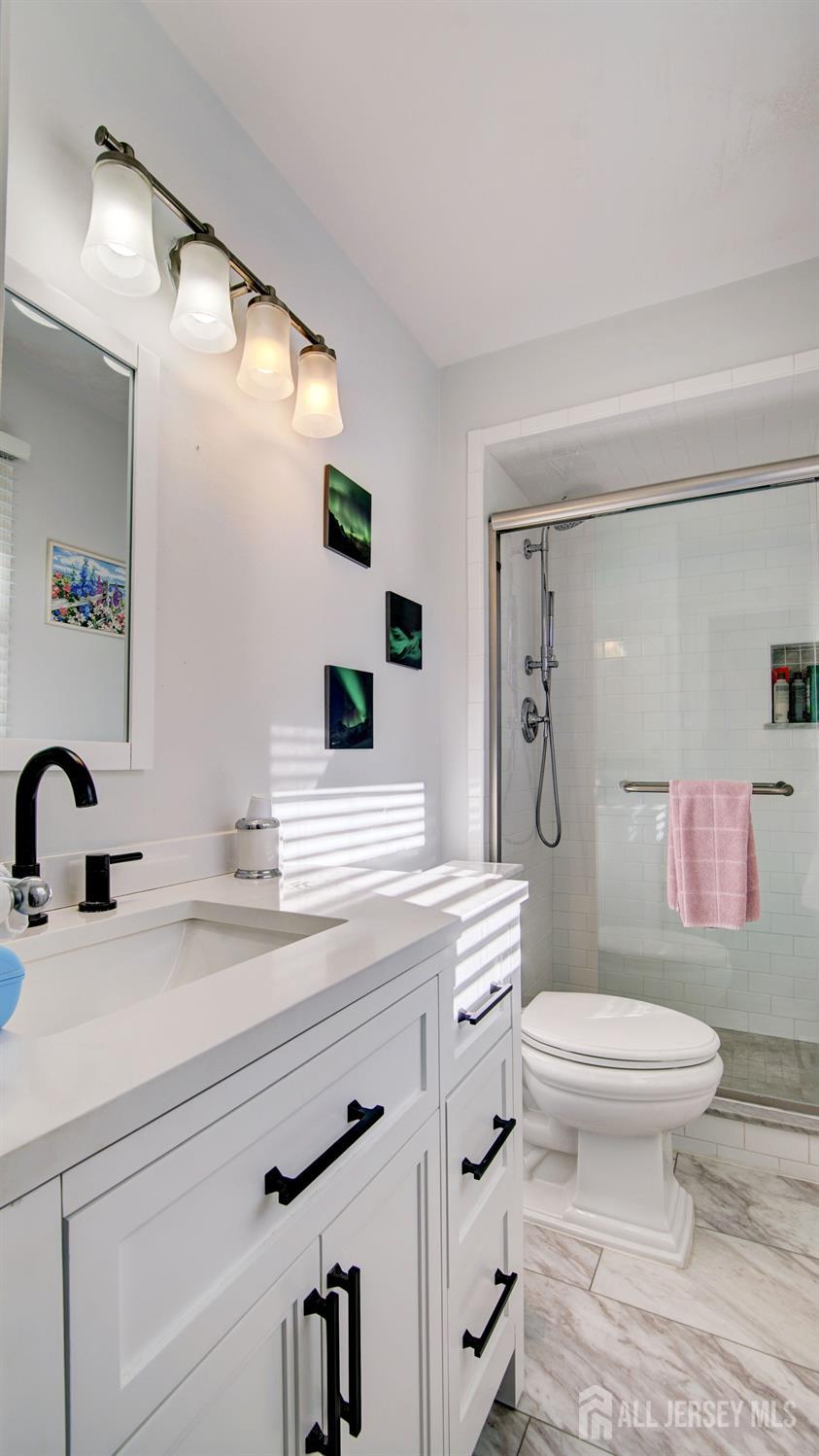 38 Mistletoe Drive Old Bridge, NJ 07747 - Photo 35 of 41 a bathroom with a sink toilet and shower