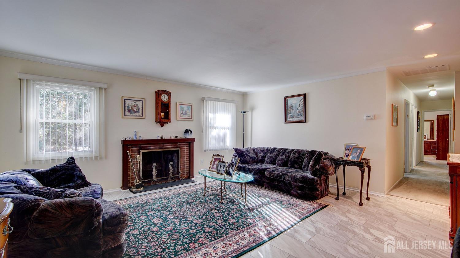 38 Mistletoe Drive Old Bridge, NJ 07747 - Photo 6 of 41 a living room with furniture and a fireplace