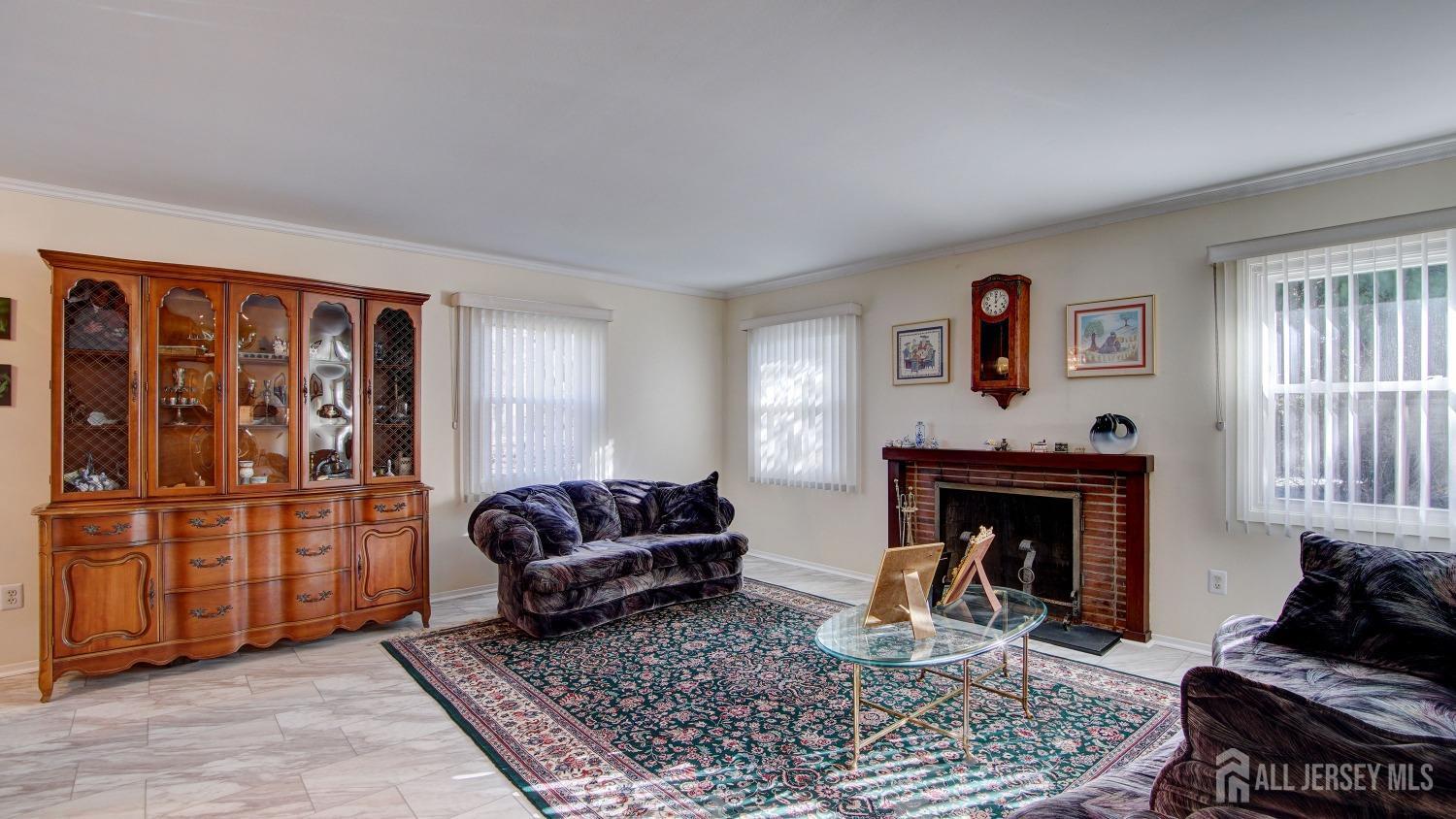 38 Mistletoe Drive Old Bridge, NJ 07747 - Photo 7 of 41 a living room with furniture a window and a fireplace