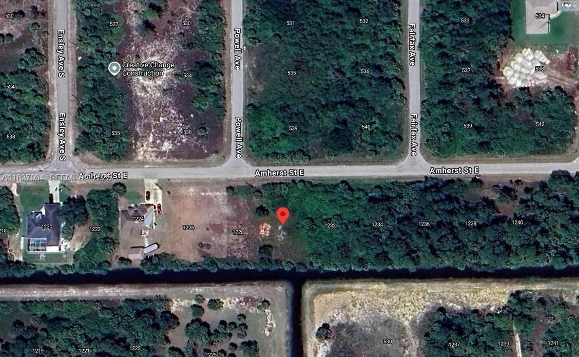 1230 Amherst Street East Lehigh Acres, FL 33974 - Photo 3 of 3 an outdoor space with wooden fence