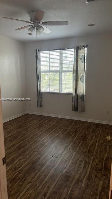 2851 Prospect Road, Unit 1211 Tamarac, FL 33309 - Photo 11 of 15 wooden floor in an empty room with a window