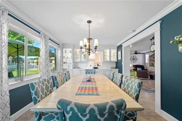 a kitchen with stainless steel appliances granite countertop a sink and a refrigerator