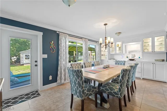 a view of a wooden chairs and table in the patio