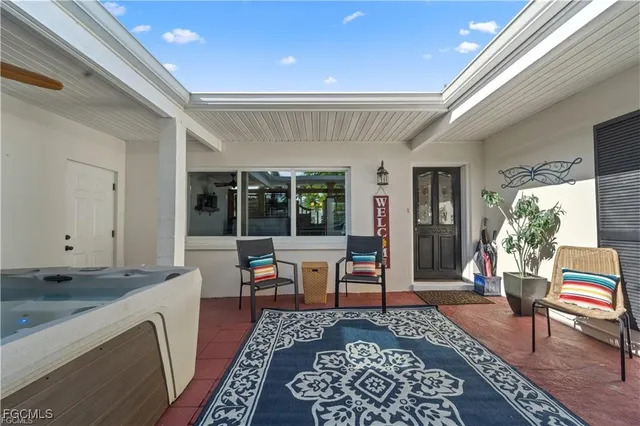 a living room with furniture and a clock