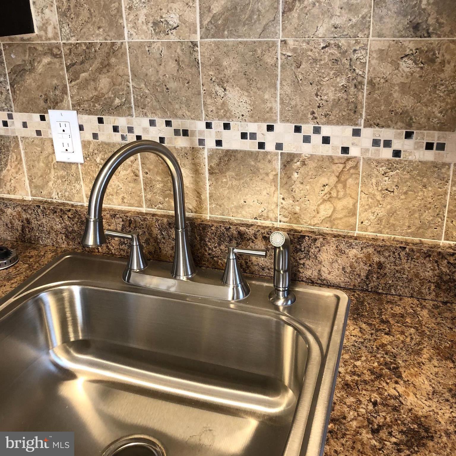 45 Upmanor Road Baltimore, MD 21229 - Photo 22 of 27 Kitchen with all new tilework and fixtures